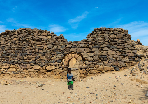 Sudanese child in gate in al Ghazali christian monastery, Northern State, Wadi Abu Dom, Sudan