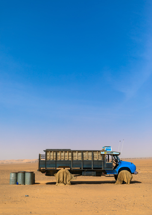 Truck in the desert with tyres protected from the sun, Northern State, Meroe, Sudan