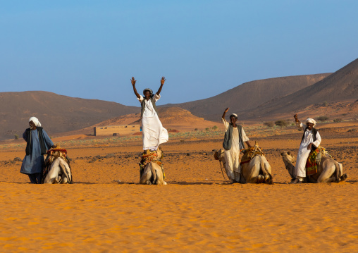 Sudanese men and their camels in Meroe, Northern State, Meroe, Sudan