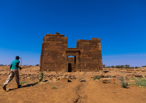 Sudanese man going to the lion temple of Apedemak, Nubia, Naqa, Sudan
