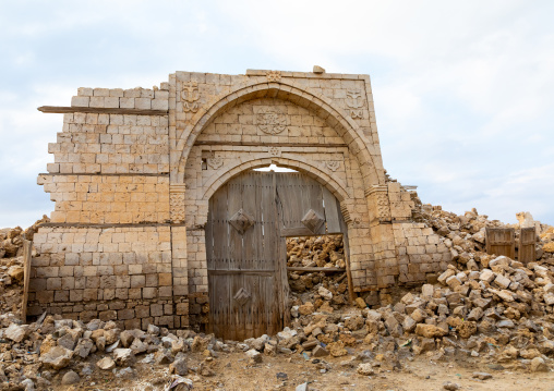 Wooden door in the middle of a ruined ottoman coral building, Red Sea State, Suakin, Sudan