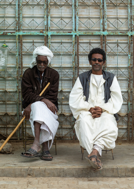 Portrait of Beja tribe men sit in the street, Red Sea State, Port Sudan, Sudan