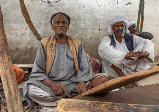 Portrait of Beja tribe men selling swords in the market, Red Sea State, Port Sudan, Sudan
