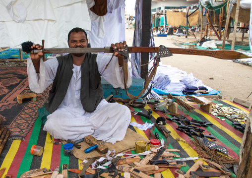 Portrait of a Beja tribe man selling sword in the market, Red Sea State, Port Sudan, Sudan