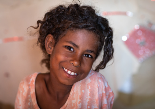 Portrait of a smiling Beja tribe girl, Red Sea State, Port Sudan, Sudan
