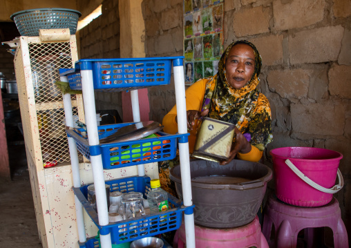 Sudanese woman selling coffee in the street, Red Sea State, Port Sudan, Sudan