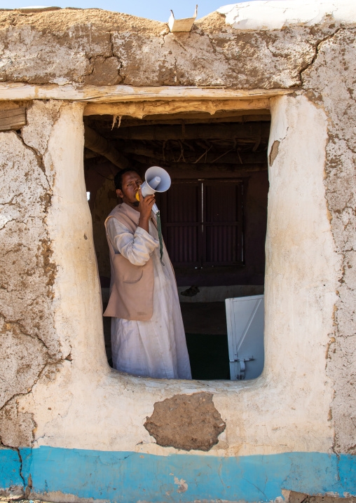 Muezzin making the call to prayers in a small mosque with a megaphone
, Kassala State, Kassala, Sudan