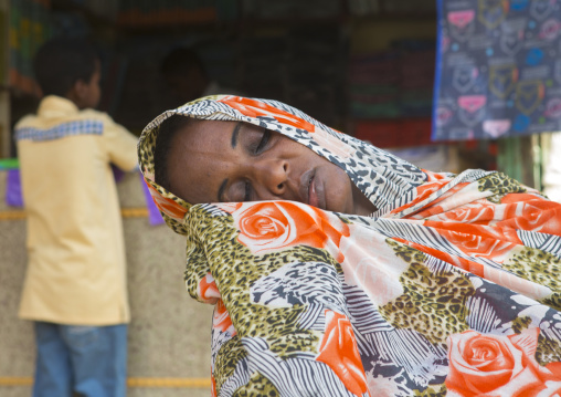 Sudan, Khartoum State, Omdurman, woman sleeping in the market