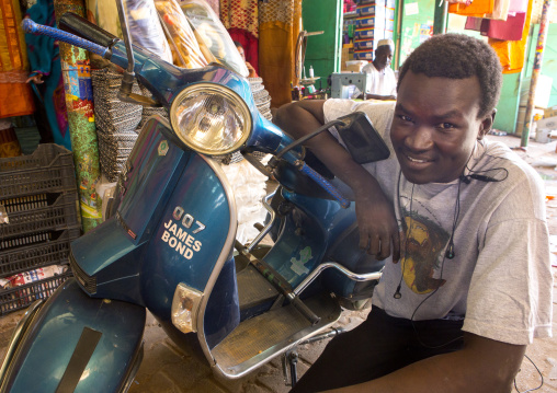 Sudan, Khartoum State, Omdurman, man with his scooter