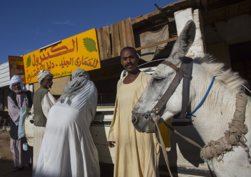 Sudan, Northern Province, Dongola, men in the street