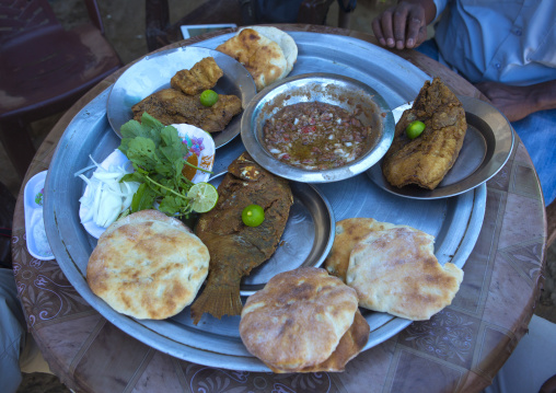 Sudan, Northern Province, Dongola, traditional breakfast with fishes, foul, and bread