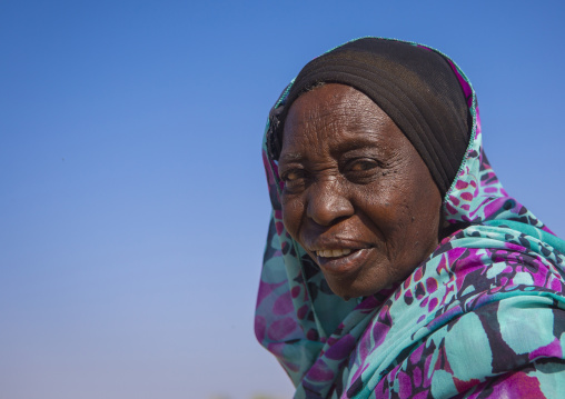 Sudan, Northern Province, Delgo, nubian ladiy dressed in the traditional, colourful tub