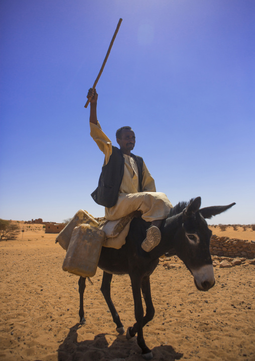 Sudan, Nubia, Naga, man riding a donkey