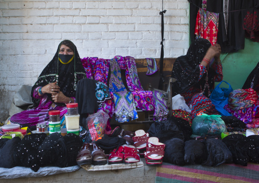 Sudan, Kassala State, Kassala, rashaida tribe women selling clothes
