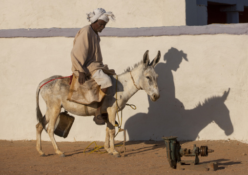 Sudan, Nubia, Soleb, man riding a donkey