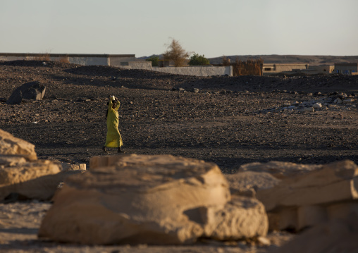 Sudan, Nubia, Soleb, woman carrying grass on her head