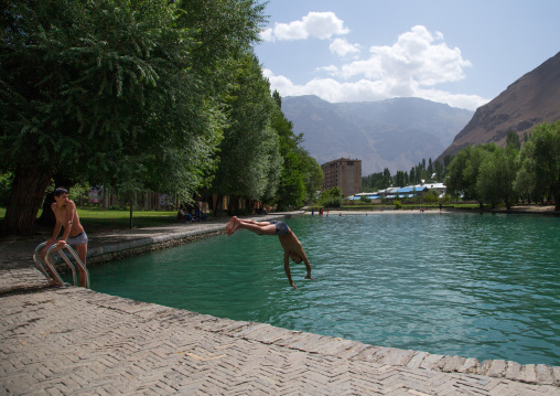 Teenage boys diving in the pool of Khorog city park, Gorno-Badakhshan autonomous region, Khorog, Tajikistan