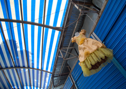 Dress for children hanging on the roof of a shop in a local market, Gorno-Badakhshan autonomous region, Khorog, Tajikistan