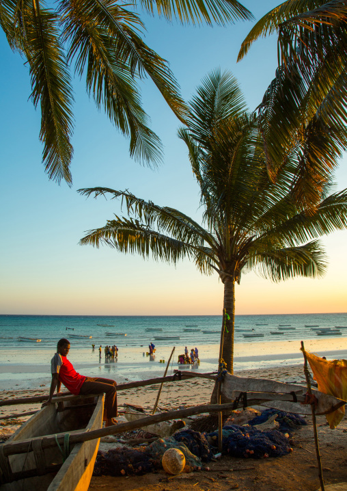 Tanzania, Zanzibar, Kizimkazi, a wooden fishing dhow resting on a sandy beach