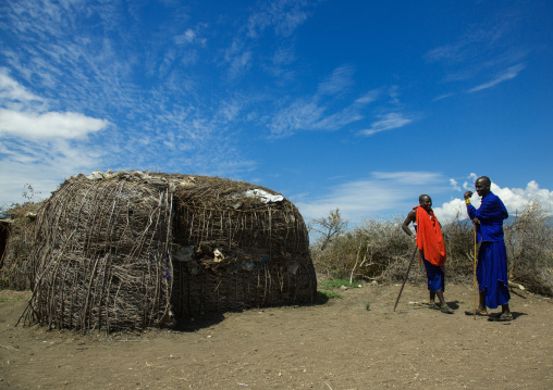 Tanzania, Ashura region, Ngorongoro Conservation Area, maasai cmen outside their home