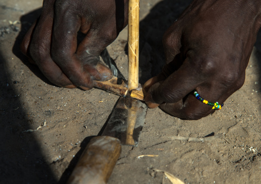 Tanzania, Serengeti Plateau, Lake Eyasi, hadzabe tribe making fire with stick woods