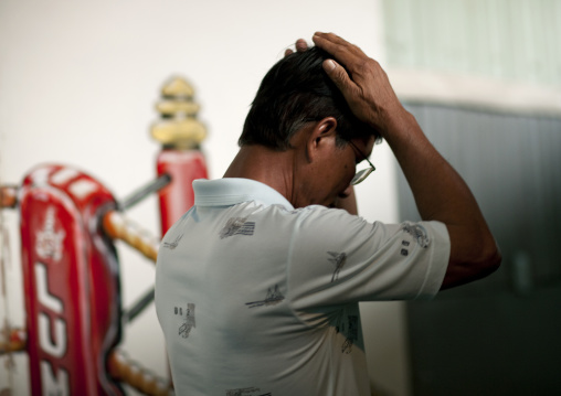 Praying for his son, Muay thai boxing, Bangkok, Thailand