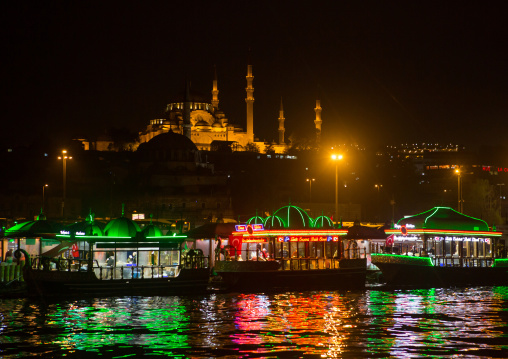 Galata bridge restaurants with Suleymaniye mosque in the back at night, Marmara Region, istanbul, Turkey