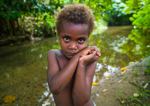 Portrait of a shy Ni-Vanuatu blonde hair girl, Efate island, Port Vila, Vanuatu