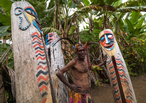 Small Nambas tribesman in front of the slit gong drums, Malekula island, Gortiengser, Vanuatu