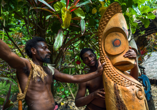Tribesmen in front of a slit gong drum, Ambrym island, Fanla, Vanuatu