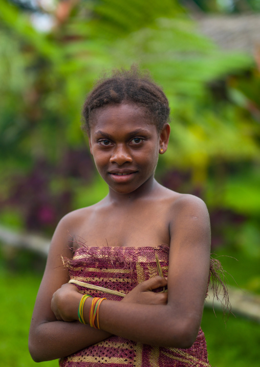 Smiling ni-vanuatu girl in traditional clothing, Sanma Province, Espiritu Santo, Vanuatu
