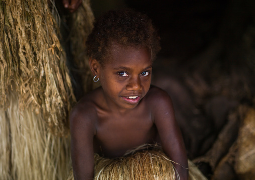 Ni-Vanuatu girl in the grass skirt of her mother, Tanna island, Yakel, Vanuatu