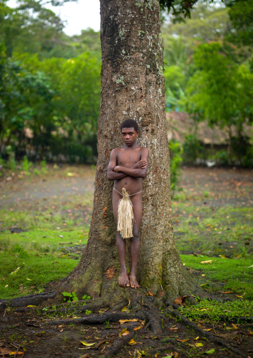 Teenage boy wearing a penis sheath called a namba, Tanna island, Yakel, Vanuatu