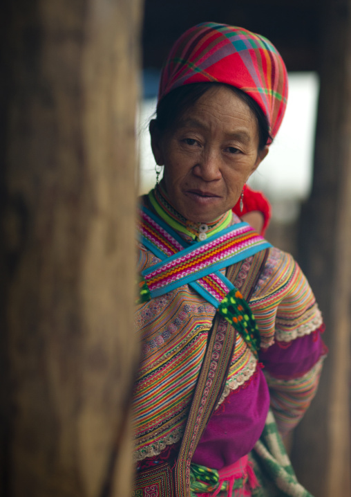 Old flower hmong woman in traditional dress, Sapa market, Vietnam