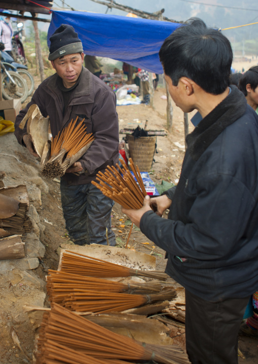 Men selling incense sticks, Sapa, Vietnam