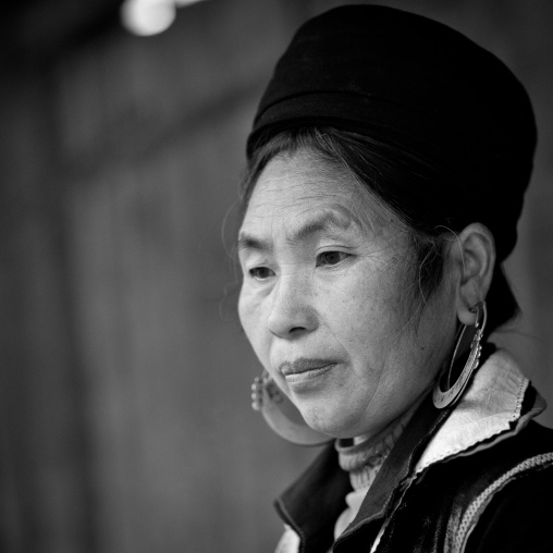 Black hmong woman with traditional headgear and earrings, Sapa, Vietnam