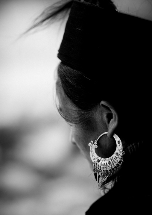 Black hmong woman wearing a big earring, Sapa, Vietnam