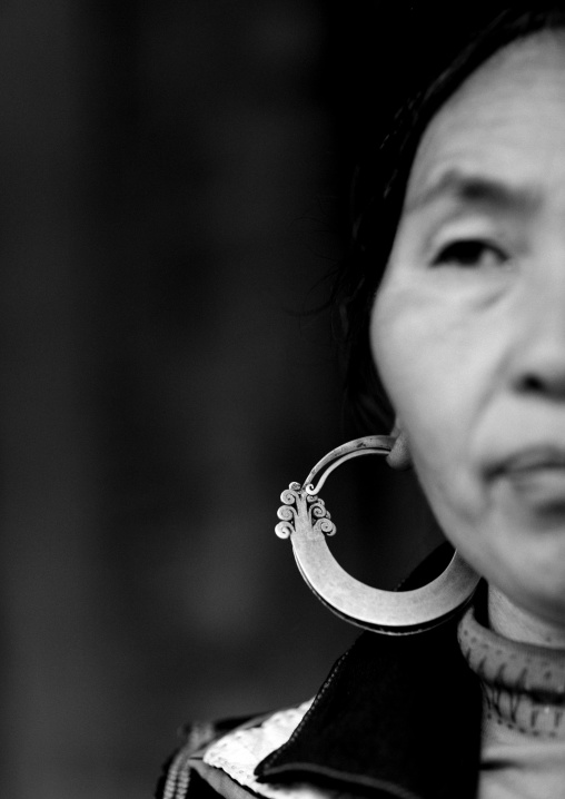 Black hmong woman wearing a big earring, Sapa, Vietnam