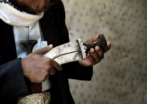 Man Checking The Pommel Of A Jambiya, Yemen
