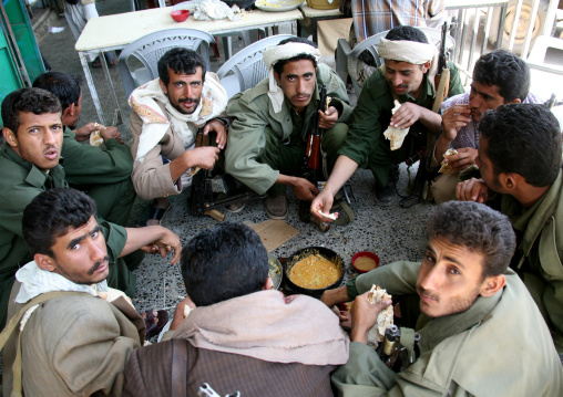 Police Men Squatting In Circle And Sharing Dinner, Shahara, Yemen