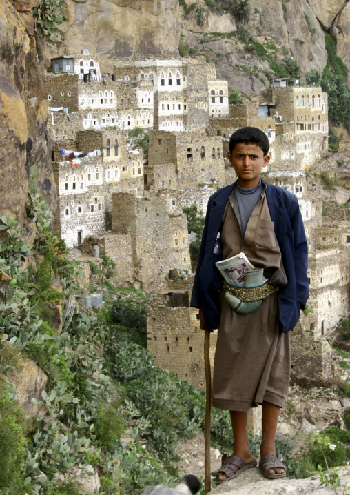 Boy In A Suit Carrying A Jambiya And Standing In Front Of The Cliff, Al Hajjara, Yemen