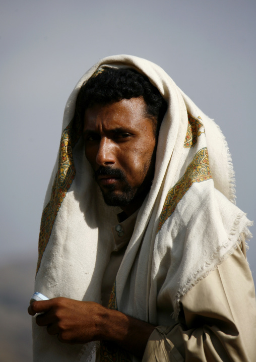Man Chewing Khat With Traditional Scarf And Mobile Phone, Shahara, Yemen
