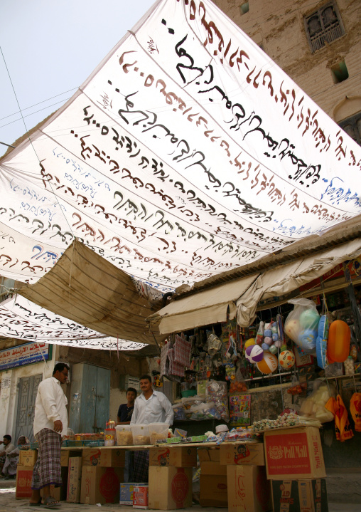 Small Shop Under A White Awning With Arabic Writing, Tarim Market, Yemen