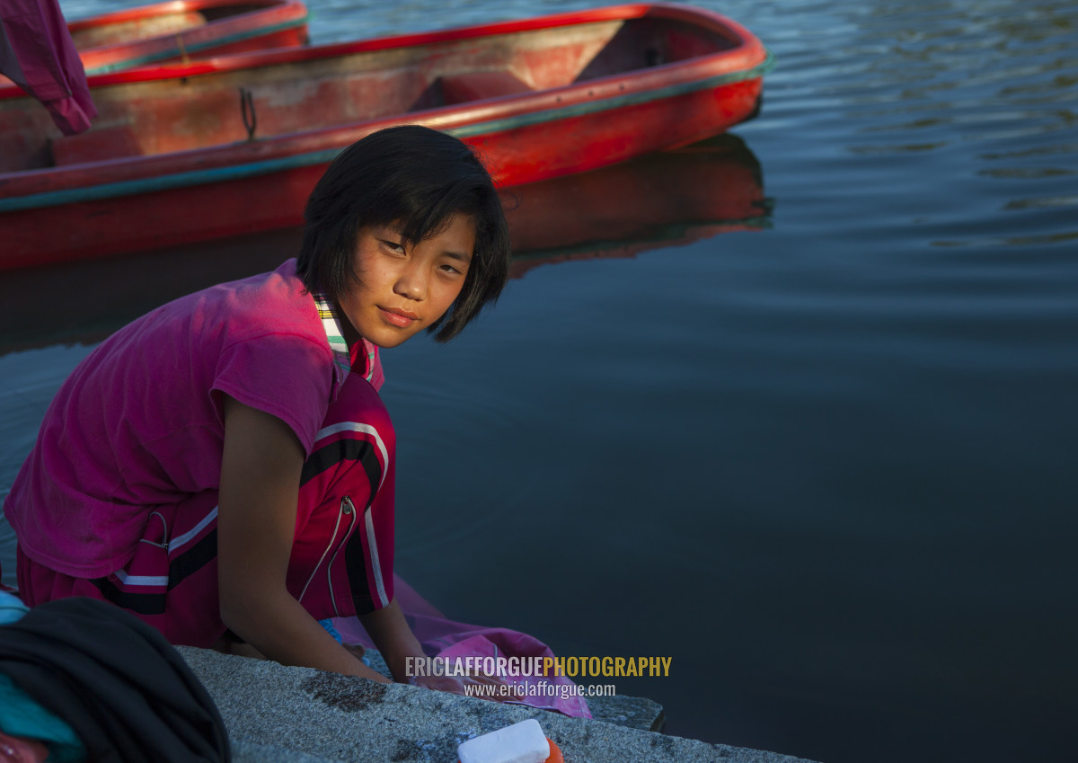 ERIC PHOTOGRAPHY North Korean girl washing her clothes in