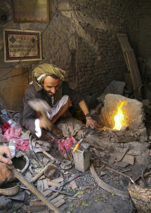 Yemeni blacksmith working in a workshop, Amanat Al-Asemah, Sanaa, Yemen