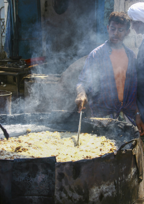 Yemeni man cooking street food, Taiz Governorate, Mokha, Yemen