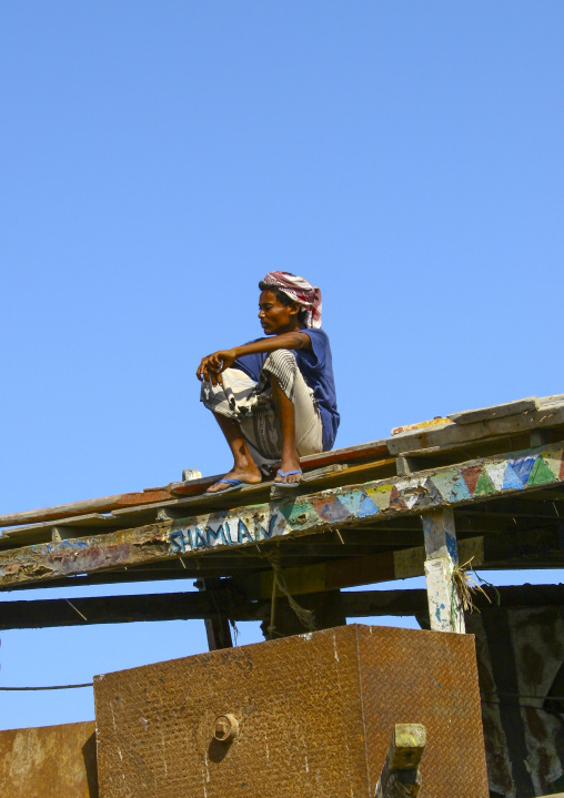 Portrait of a yemeni man sit on a dhow, Al Hudaydah Governorate, Hodeidah, Yemen