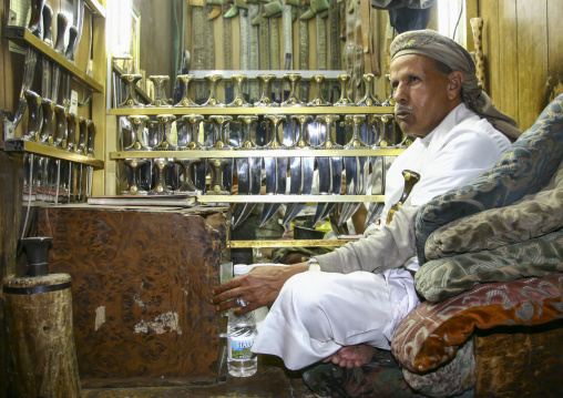 Yemeni man selling jambiyas in a shop, Amanat Al-Asemah, Sanaa, Yemen