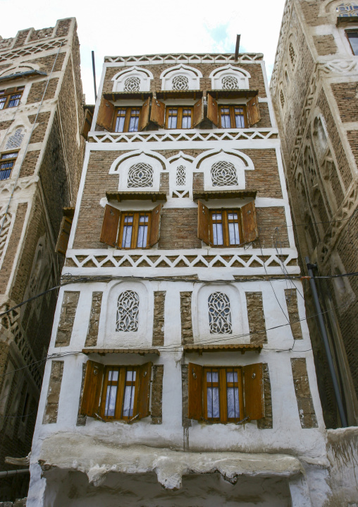 Traditional house in the old city featuring stained-glass windows, Amanat Al-Asemah, Sanaa, Yemen