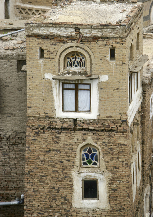 Traditional house in the old city featuring stained-glass windows, Amanat Al-Asemah, Sanaa, Yemen